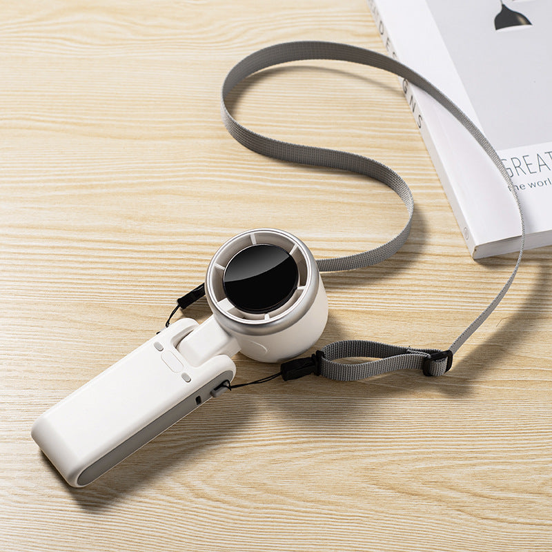 NNEDSZ Black Compact and Foldable Mini Projector – Portable and Versatile for Home and Office Use